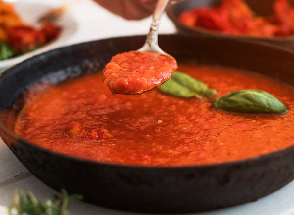 Cooking marinara sauce in a pan